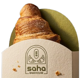 A Saha Bakehouse croissant wrapped in branded packaging